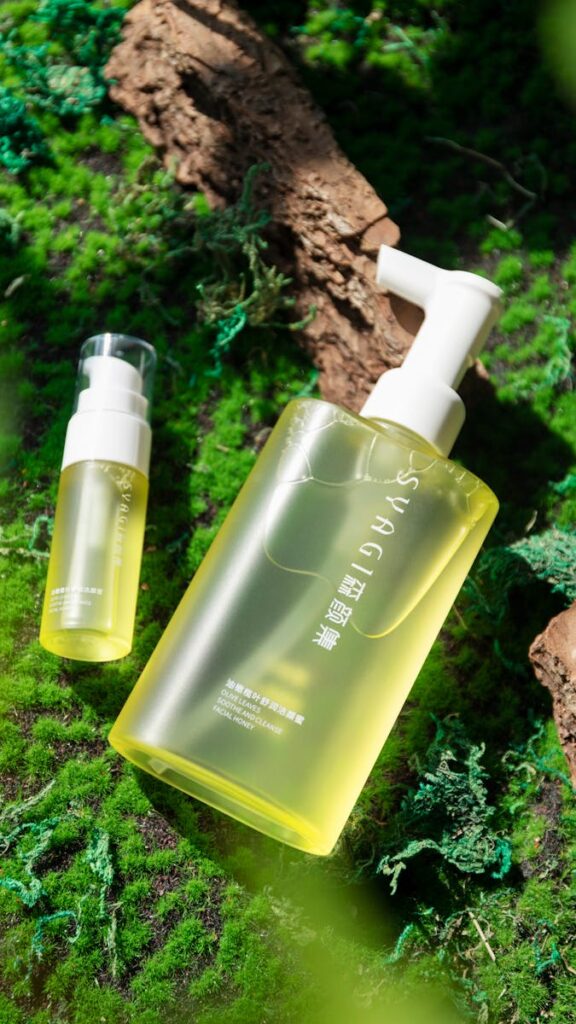 Organic skincare bottles on moss, perfect for self-care themes.