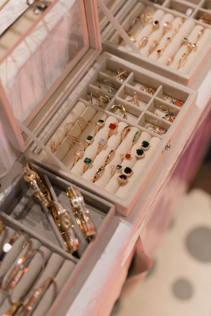A close-up view of a jewelry box showcasing a variety of elegant rings and bangles in a sophisticated setting.