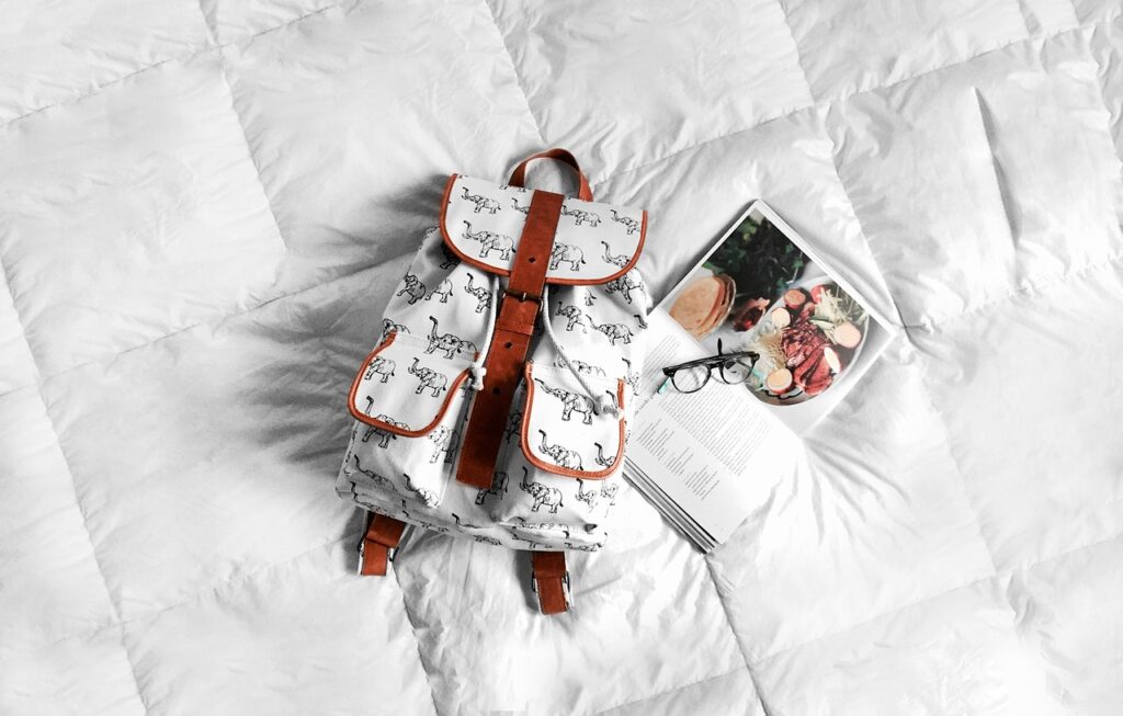 backpack, bed, book, eyeglasses, white, backpack, backpack, backpack, backpack, backpack, bed