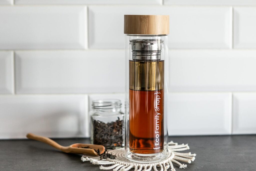 Stylish eco bottle showcasing tea in a minimalist indoor setting, ideal for modern kitchen decor.