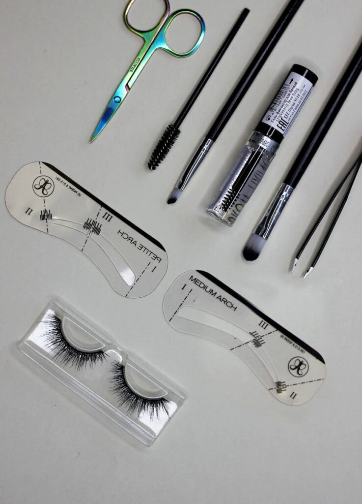 A collection of essential makeup tools for achieving perfectly shaped eyebrows.