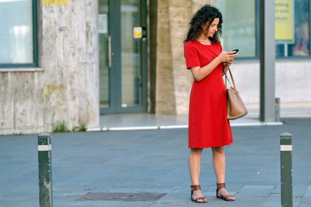 woman, red dress, phone, purse, bag, young, the person, building, the sidewalk, urban, town, red dress, red dress, red dress, red dress, red dress, phone, phone, purse, purse, bag, bag, bag, bag