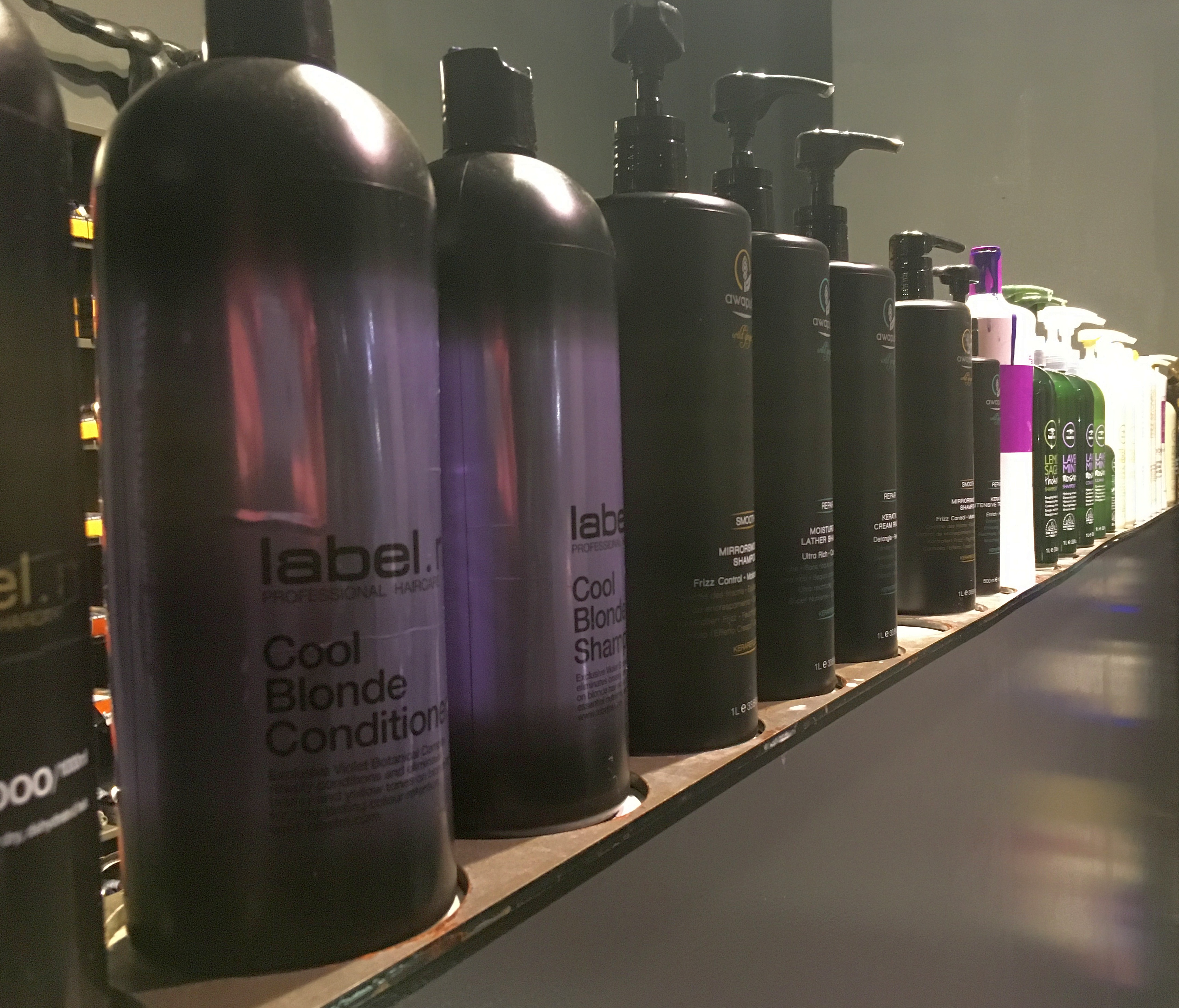 Hair shampoos, conditioners and other hair care products in liter bottles for use in hair salon