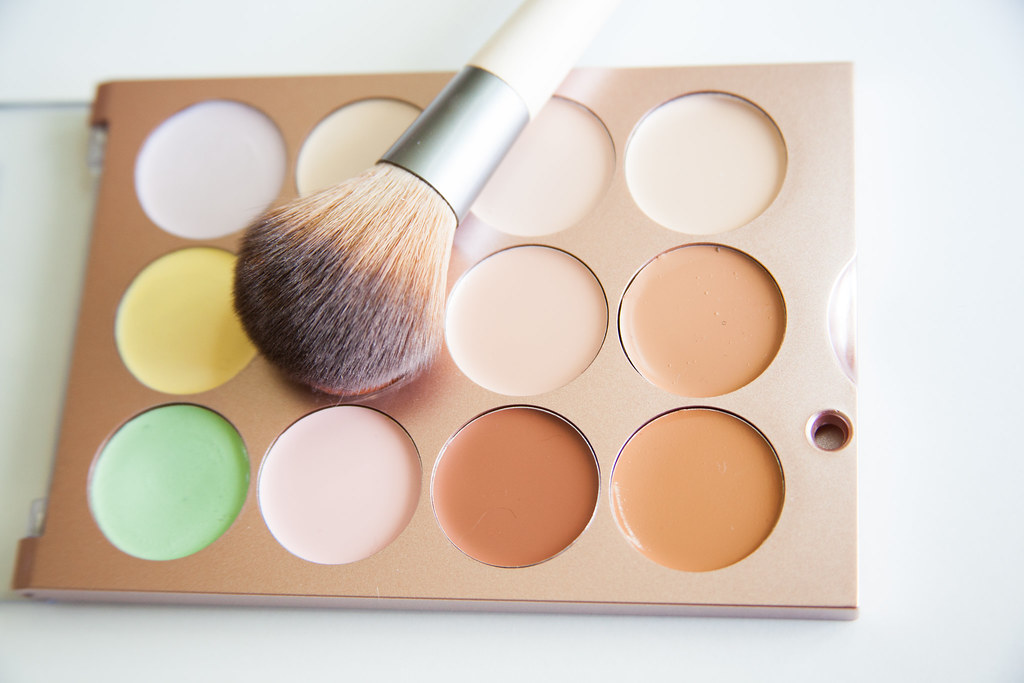 colorful makeup palette with brush