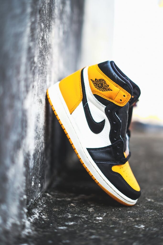 Close-up of Air Jordan 1 sneakers showcasing stylish design against an urban backdrop.