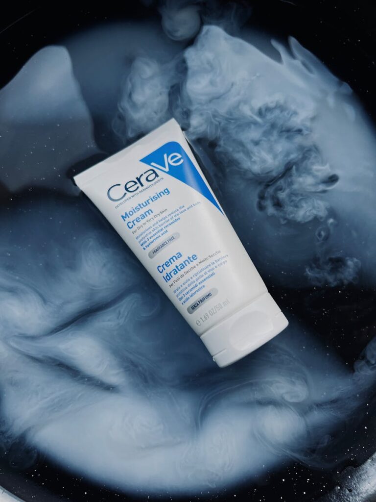 CeraVe Moisturising Cream displayed on a swirling abstract blue and white background.