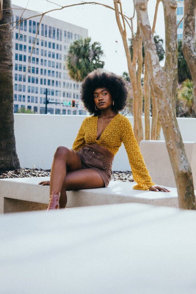 Fashionable woman with afro hairstyle posing on a sunny day in Tampa.