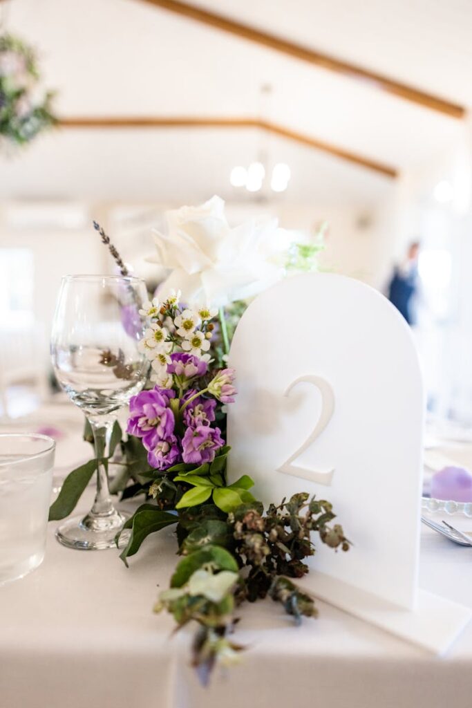 Beautiful wedding table arrangement with flowers and glassware, perfect for a romantic occasion.