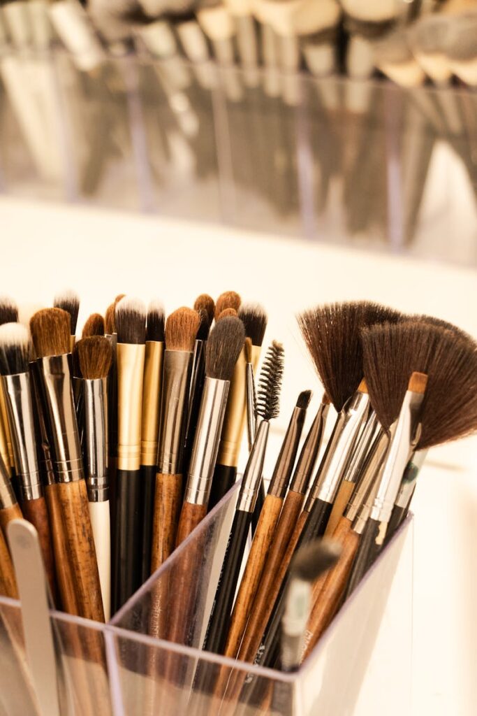 Close-up of assorted makeup brushes in a holder for beauty and cosmetics enthusiasts.
