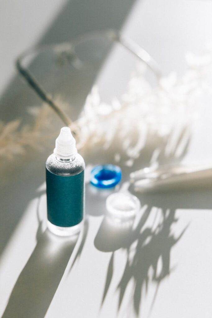 Elegant minimalist product shot featuring eye care items in natural light.