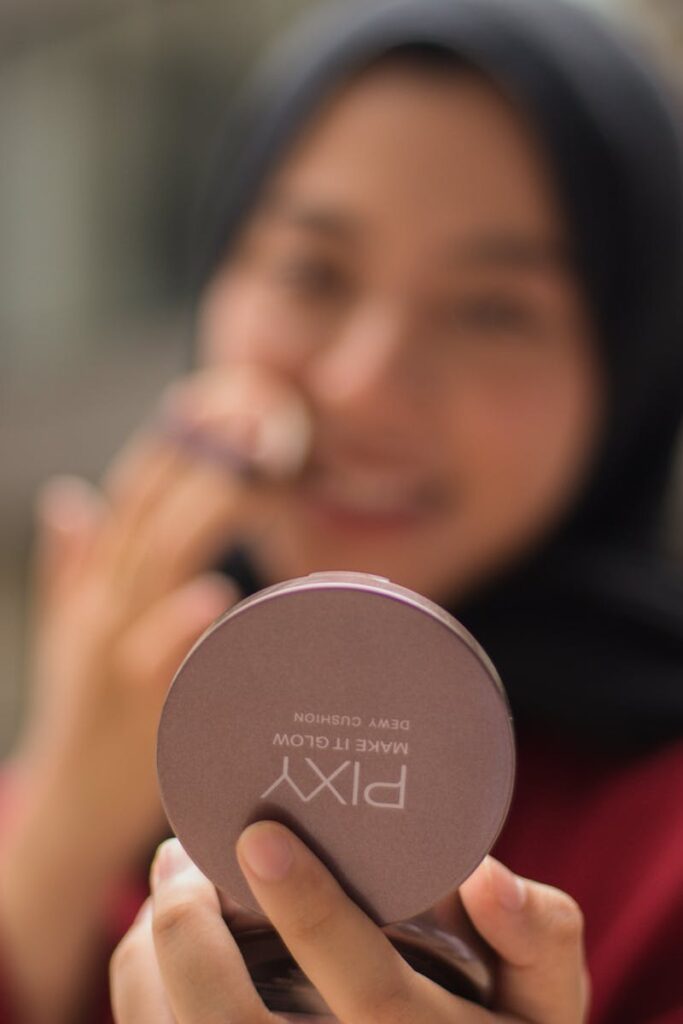 Close-up of a woman applying Pixy cushion foundation, showcasing beauty and skincare.