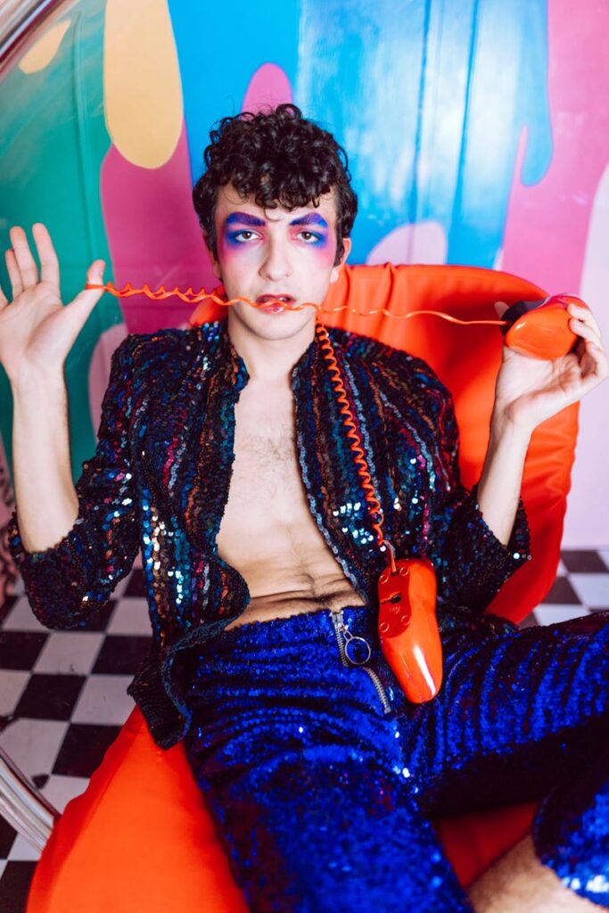 A colorful artistic portrait showcasing bold fashion and makeup with retro elements.