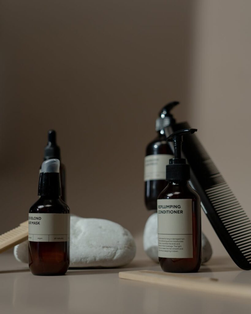 Luxurious display featuring brown bottles of hair care products against a neutral backdrop. Perfect for beauty branding.