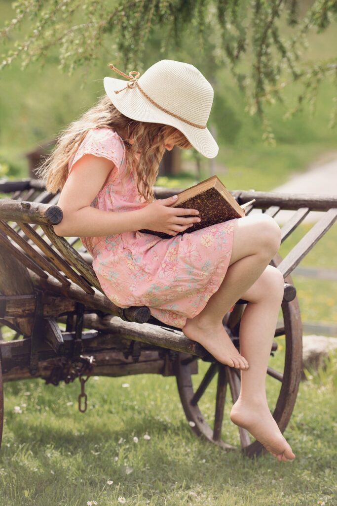 child, girl, book, read, reading, little girl, hat, nature, outdoors, book reading, portrait, book, book, read, reading, reading, reading, reading, reading, little girl, little girl