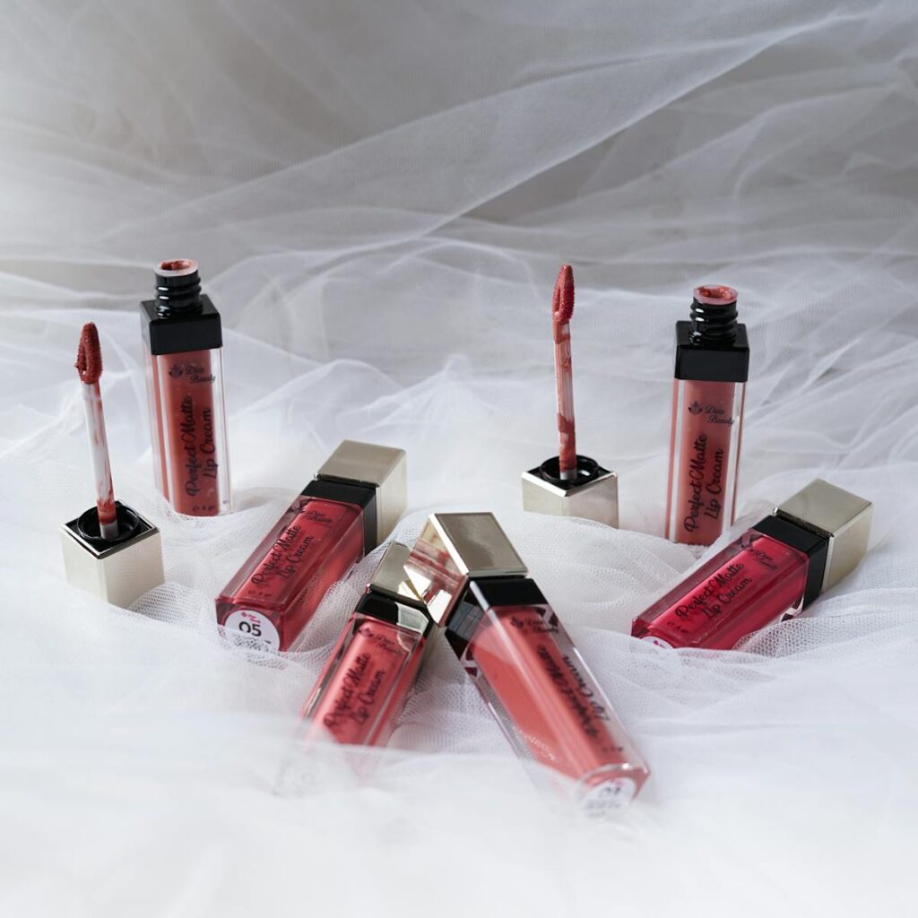 A stunning display of various lipsticks on soft white fabric, showcasing elegance and style.