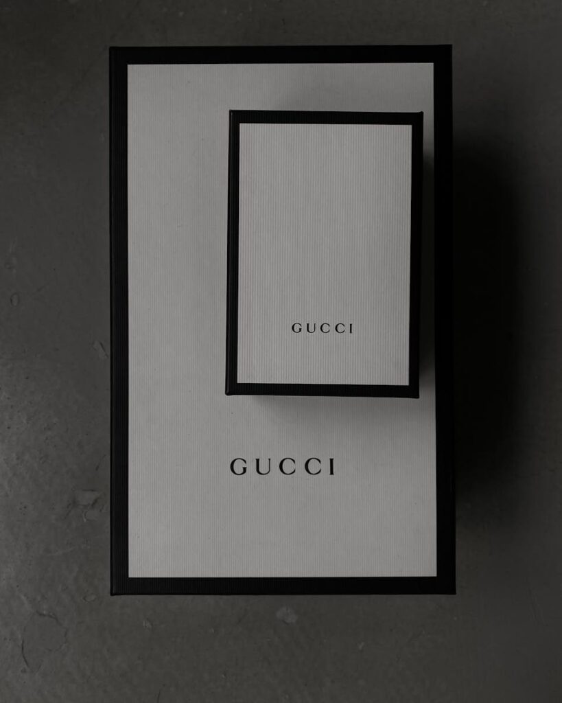 Minimalistic top view of Gucci boxes, perfect for luxury product presentations.