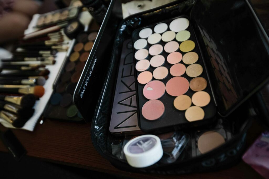 Assorted makeup palette and brushes set, perfect for professional or personal use.