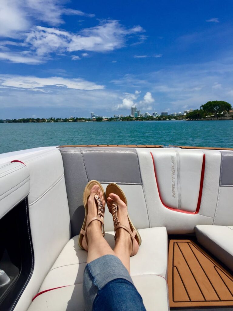 Enjoy a sunny day relaxing on a luxury yacht with a city skyline view.