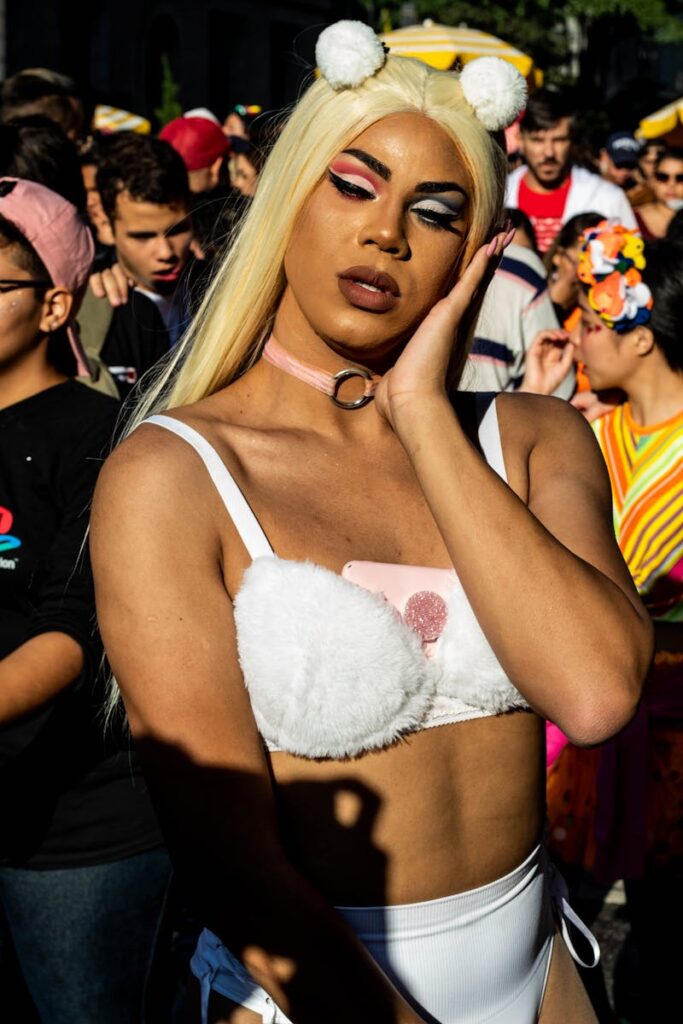 Colorful pride festival in São Paulo with diverse participants and vibrant costumes.