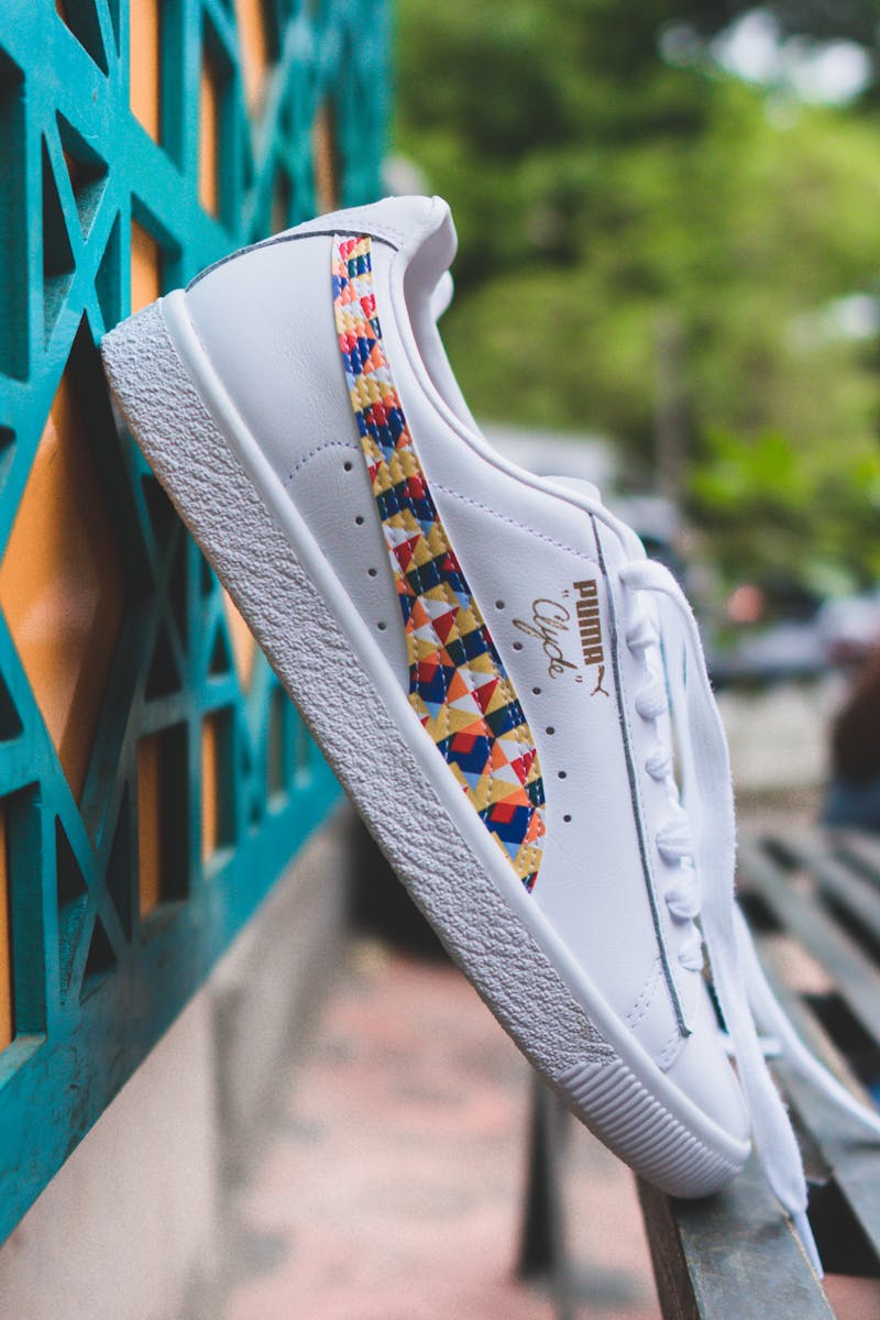 Close-up of a stylish white sneaker with colorful patterns. Ideal for fashion and lifestyle themes.