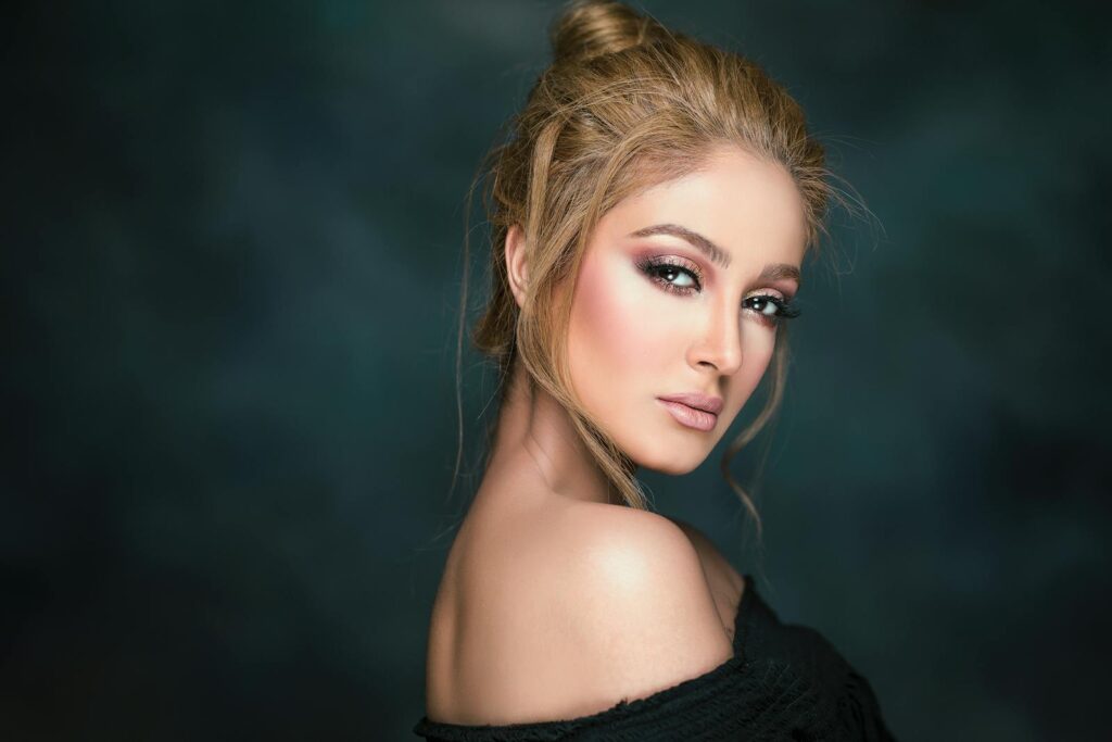 Stunning portrait of a glamorous woman showcasing elegant makeup and hairstyle.