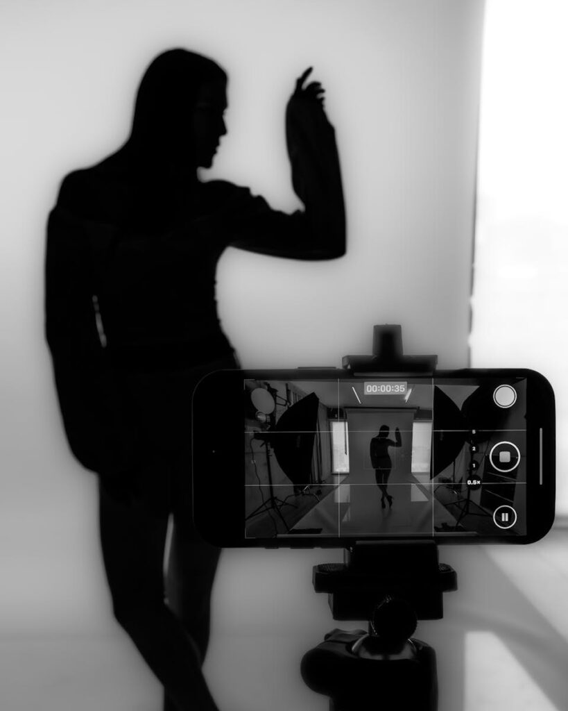 A striking silhouette captured in a professional photo studio setup with creative lighting.