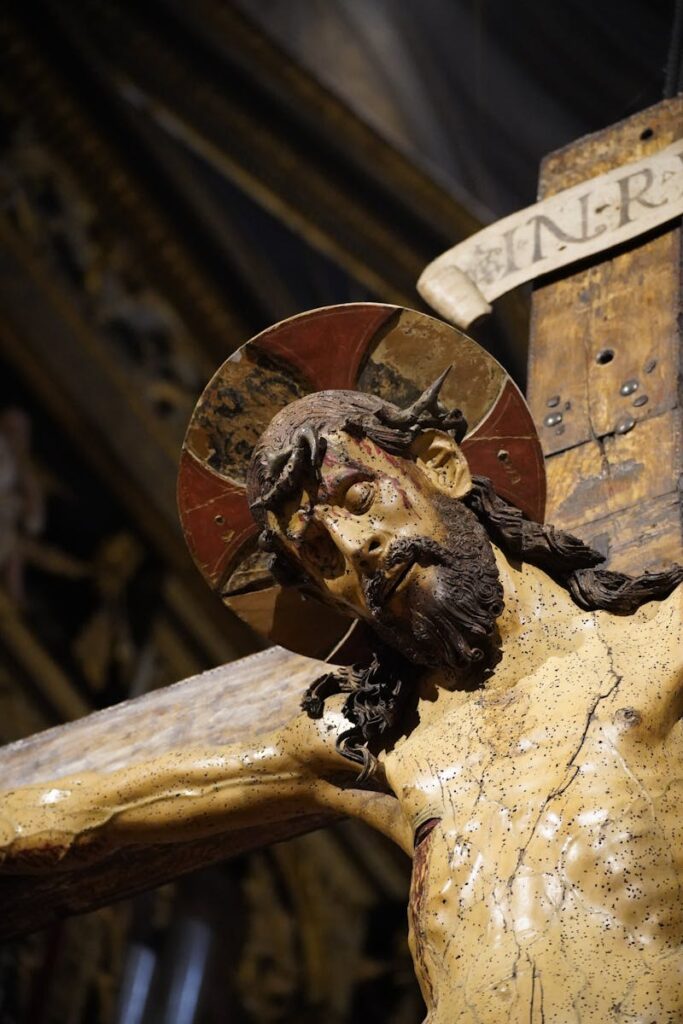 Close-up of a crucifix sculpture in Salò, showcasing intricate details and artistry.