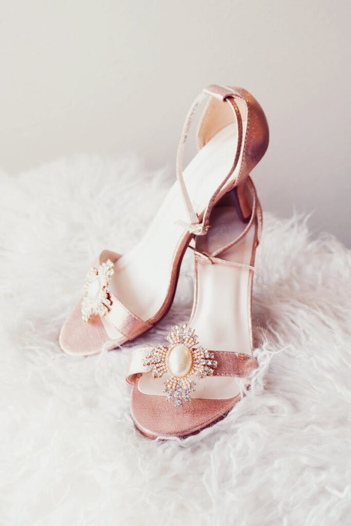 Stylish pink sandals with pearl and diamond accents, perfect for fashion-forward occasions.