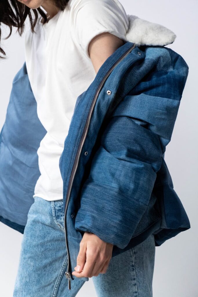 Jeans and denim jacket fashion portrait with white tee on a white background, perfect for trend and style concepts.