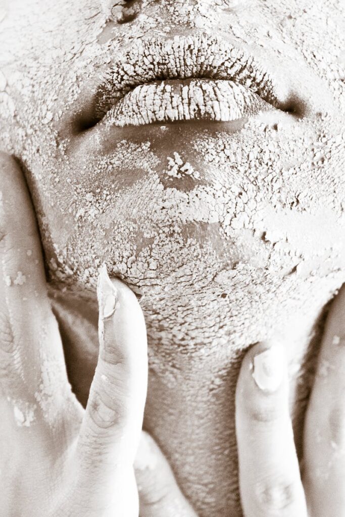 Artistic close-up of a woman's textured skin emphasizing raw beauty and skincare challenges.