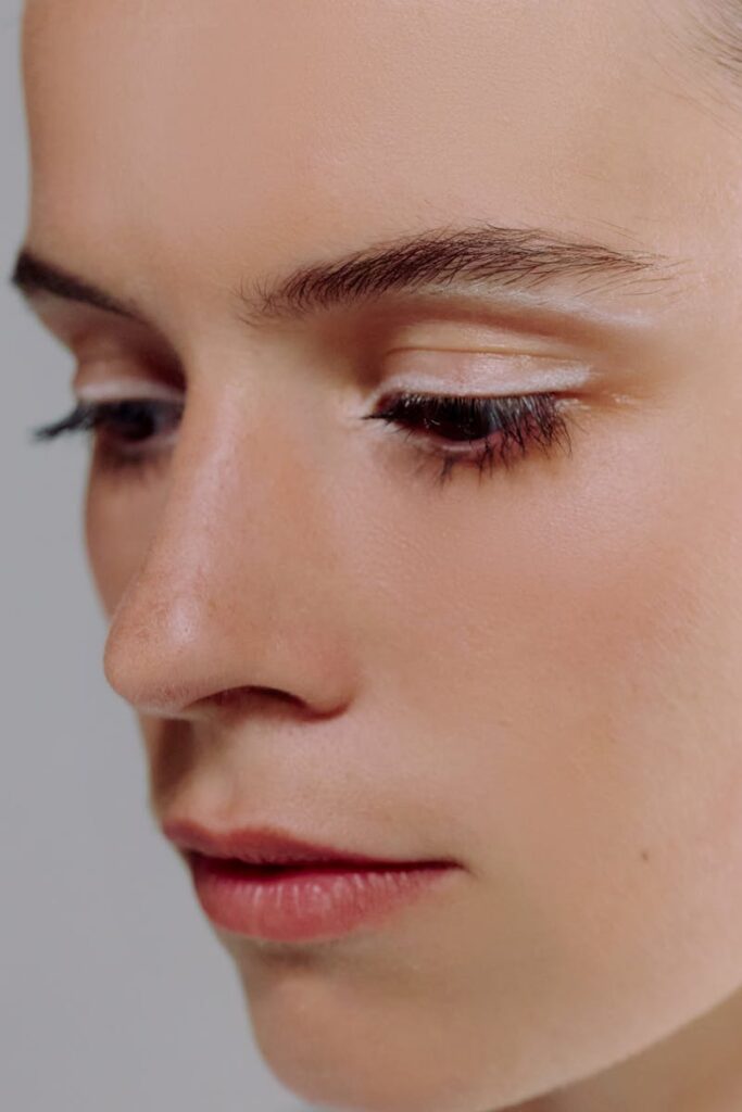 Detailed close-up portrait showcasing a woman's facial features and makeup.