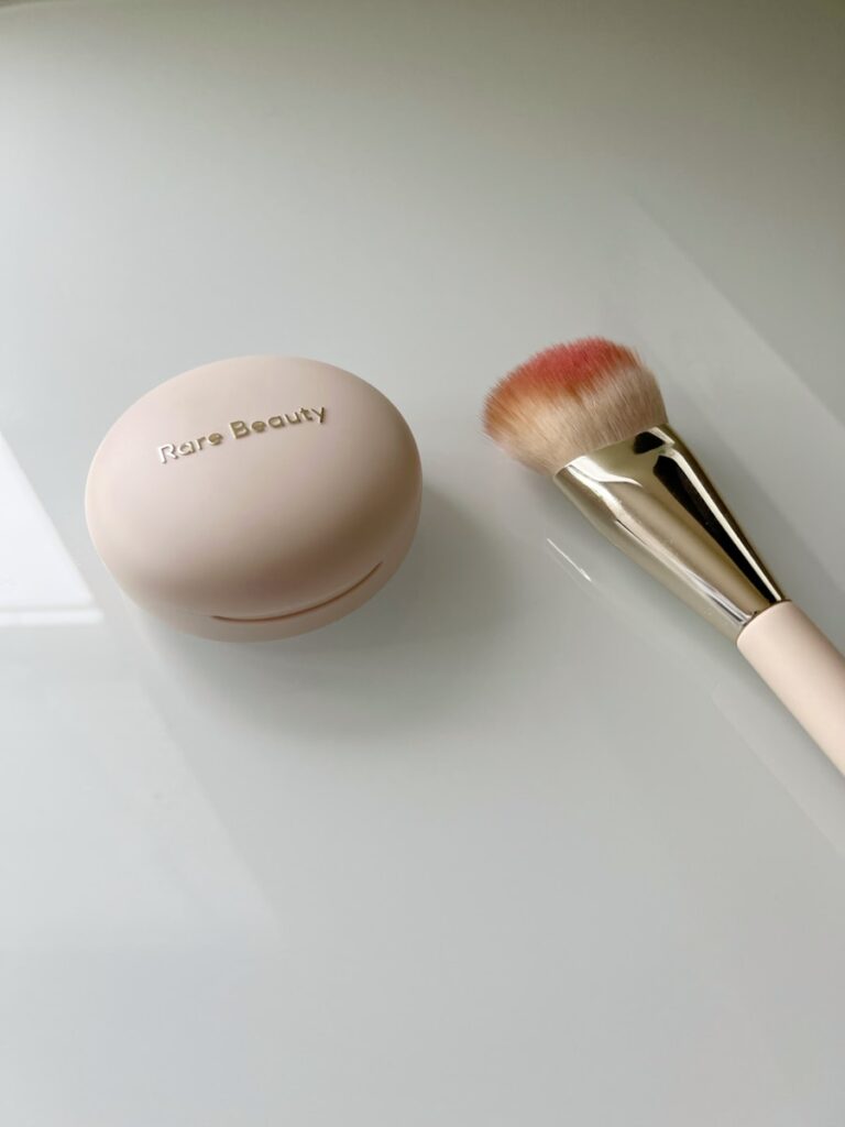 A brush and a powder on a table