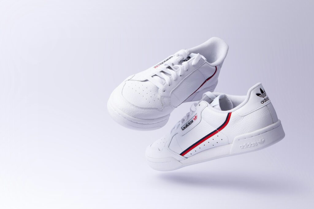 white adidas low-top sneakers