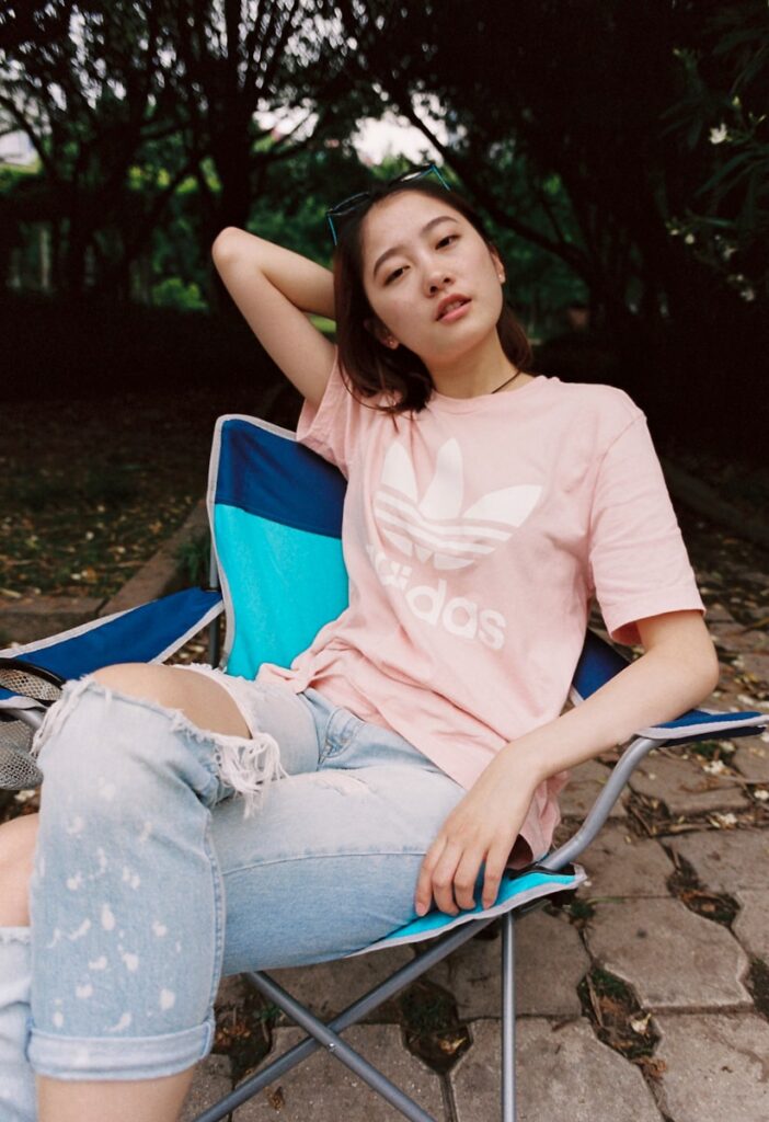 woman in pink adidas crew-neck T-shirt