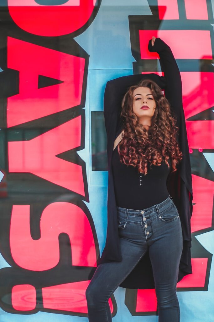 woman leaning on wall