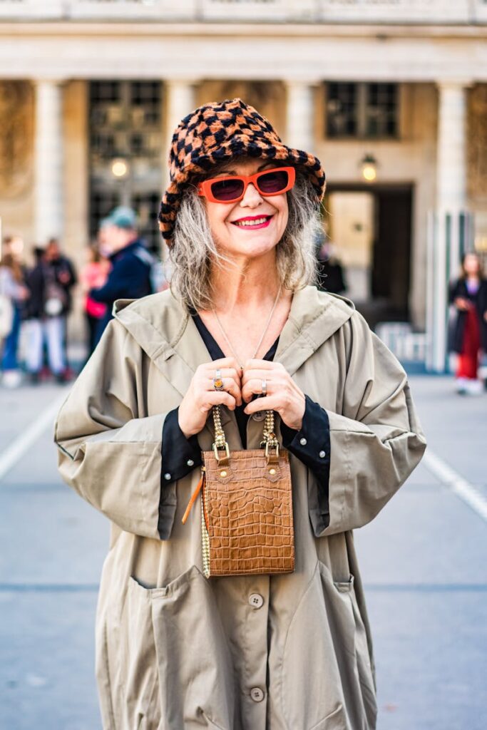 Stylish senior woman wearing a houndstooth hat in Paris, showcasing fashion elegance.