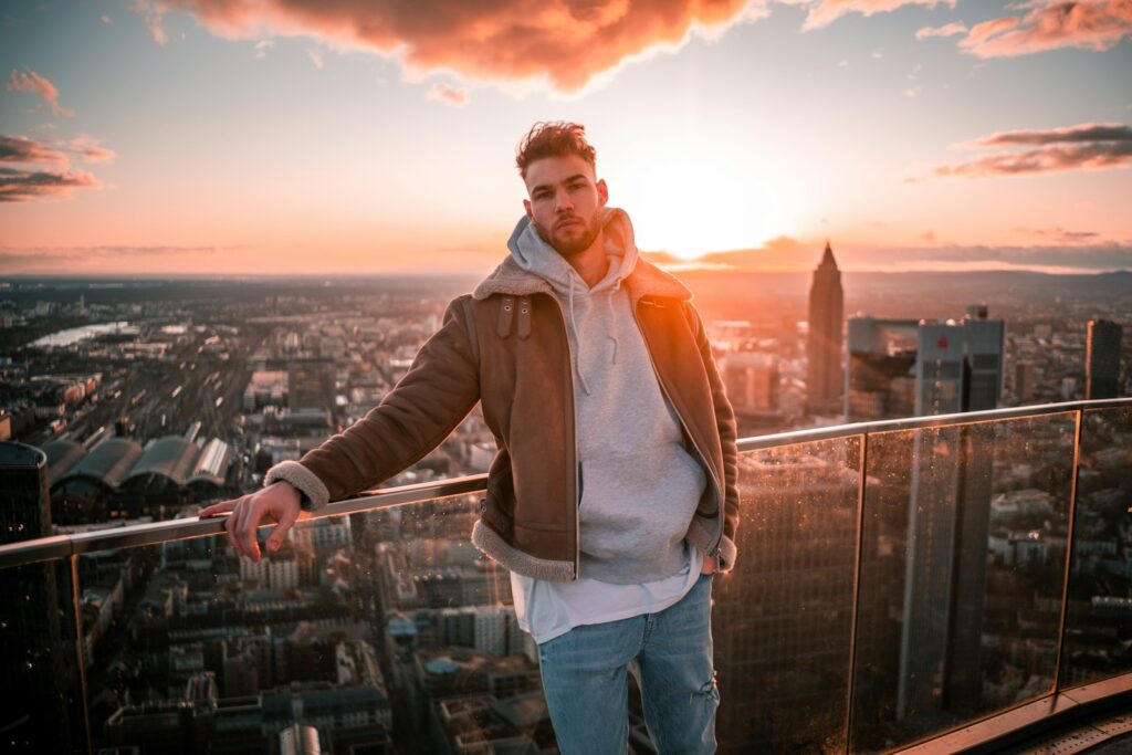 a man standing on top of a tall building