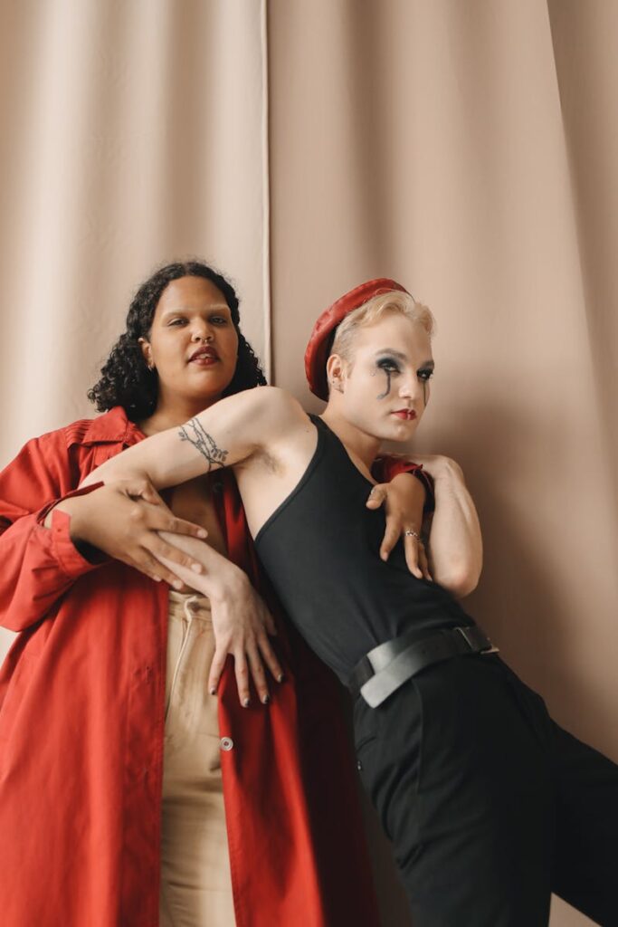 Stylish portrait of diverse friends in fashionable attire, expressing individuality and unity in a studio setting.