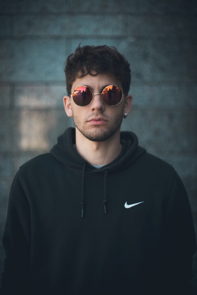 man standing wearing black Nike hoodie