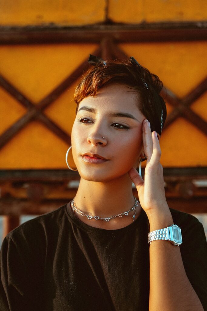 A woman wearing a black shirt talking on a cell phone