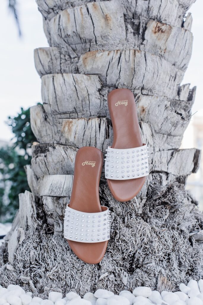 woman in white lace panty and brown leather shoes