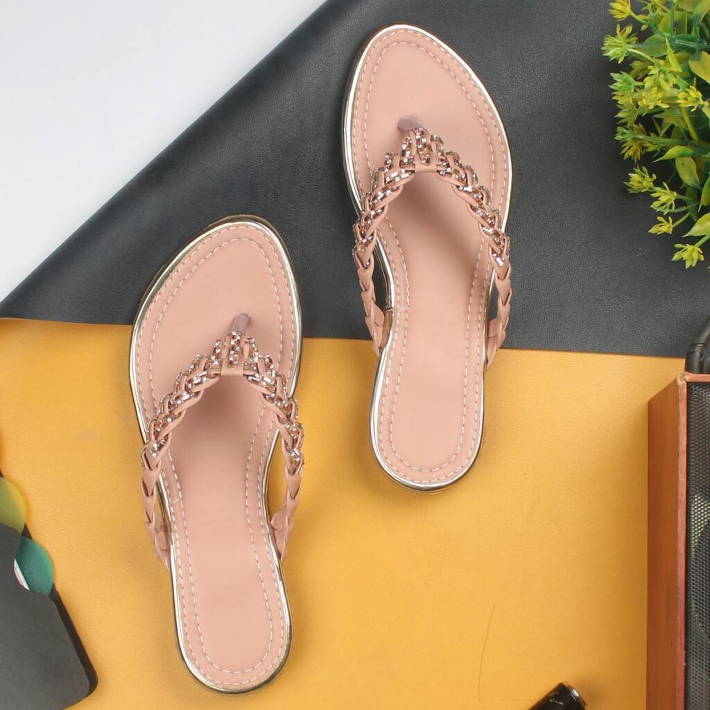A pair of fashionable women's sandals showcased on a vibrant and stylish background setting.