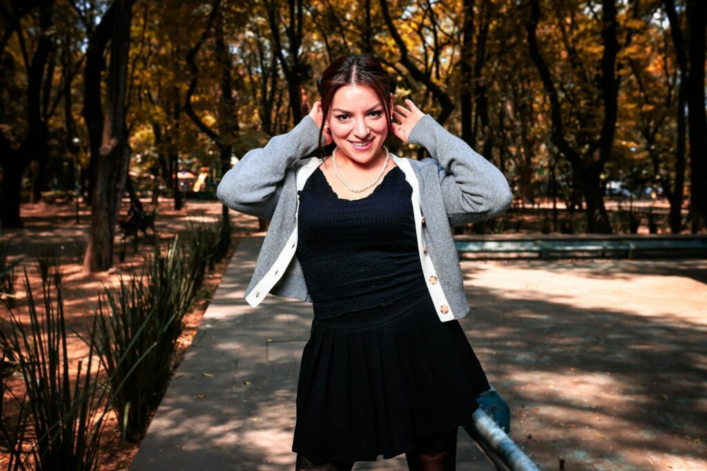 Charming woman in urban fall setting, showcasing stylish autumn fashion.