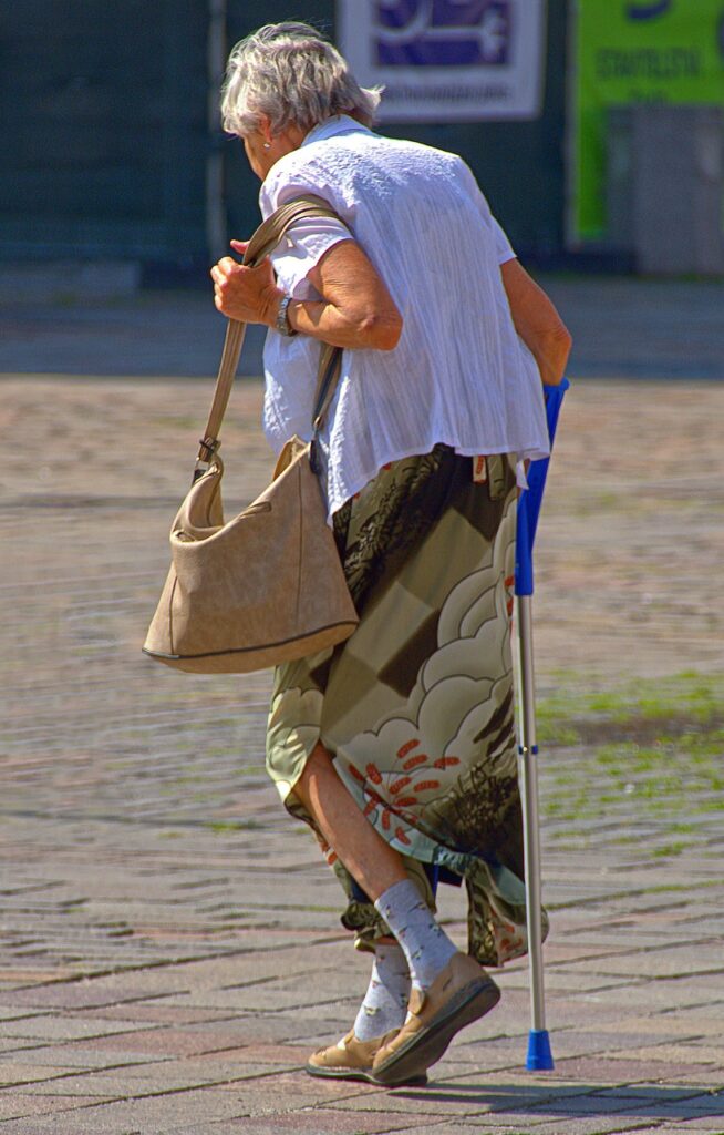 woman, seniorin, with special needs, crutch, walking stick, walker, old, running, move, walk, watch, clothing, mood, aging, old woman, blouse, skirt, female, feminine, urban, walking stick, walking stick, walking stick, walking stick, walking stick, walker, walker