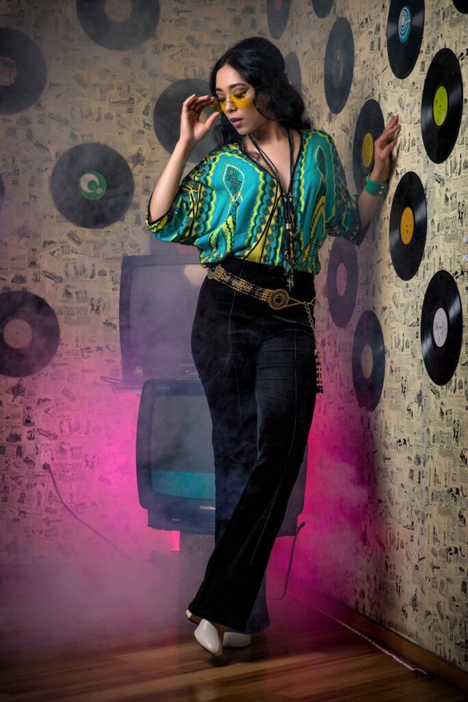 Woman in 70s attire with vinyl records and smoky ambiance, stylish and vibrant.