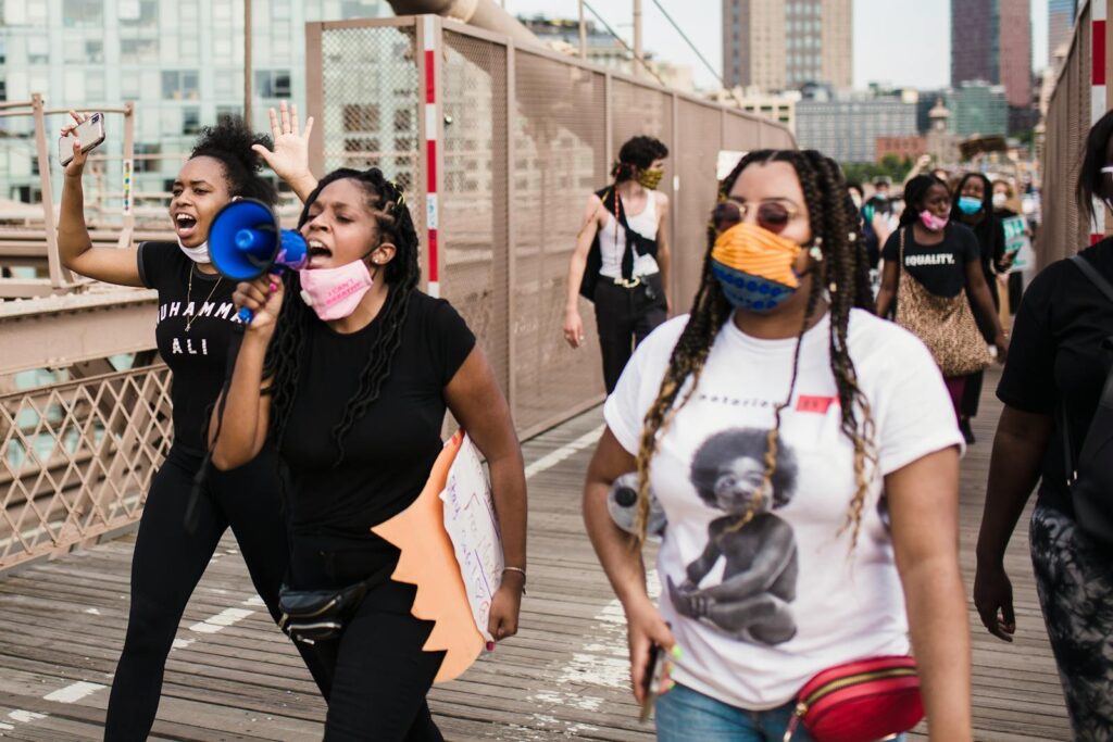 Group of diverse people gathered for a Black Lives Matter protest outdoors in the city.