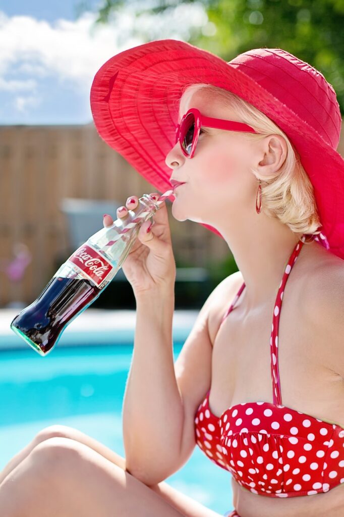 woman, drinking, coca-cola, bikini, polka dot bikini, swimsuit, swimwear, beach hat, sunglasses, shades, coke, drinking coke, refreshment, summer, nature, pool, red, vacation, water, resort, tropical, sunny, female, outdoors, relaxing, portrait, vintage, fashion, style