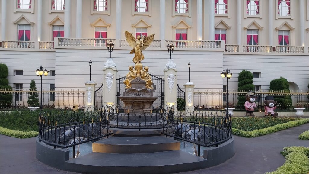 a large building with a statue in front of it