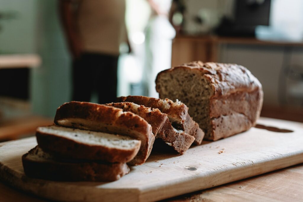 a loaf of bread sitting on top of a cutting board