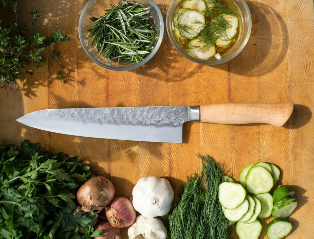 sliced vegetables and meat on chopping board